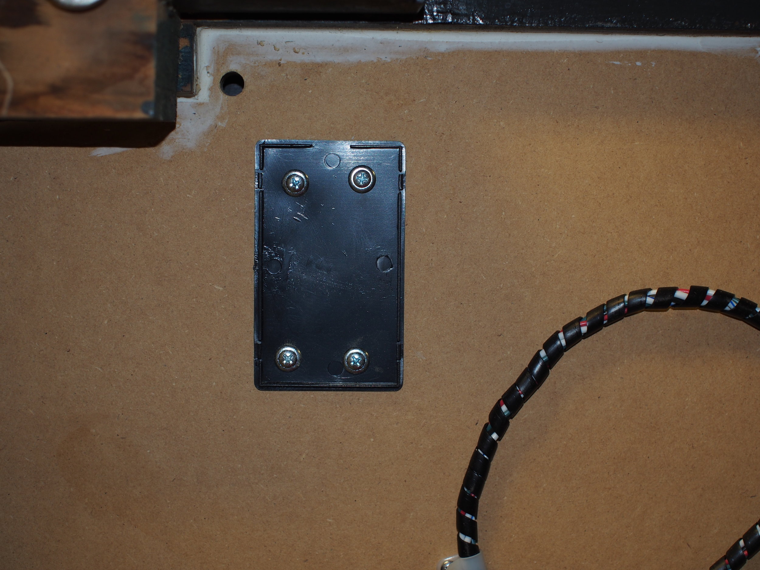 The case lid, along with the hole for the dial wires and the LED power leads